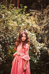 child girl in fairytale princess dress in summer forest