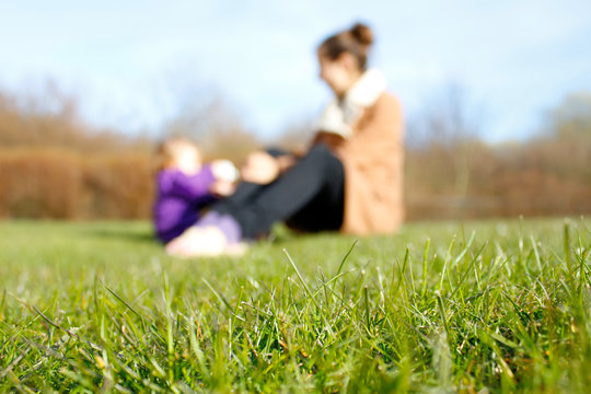 Mom and daughter on grass