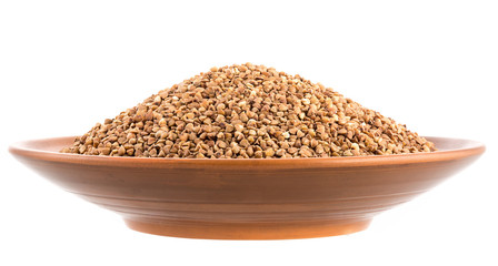 Dry buckwheat groats on  bowl