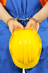 failure guilty laborer regretful criminal handcuffed hard hat