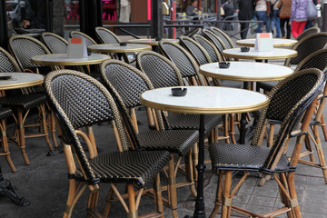 Street view of a coffee terrace with tables and chairs,Paris Fra