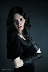 Naklejka premium Beautiful girl in fashion style in black dress and gloves