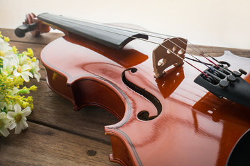 Close up of violin on wooden table