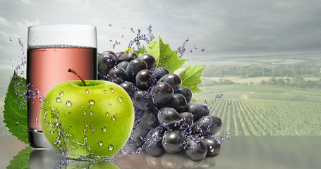 Green Apple and black grapes with a glass of juice.
