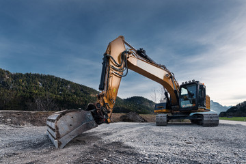 Fototapeta na wymiar view to huge orange mechanical shovel excavator on gravel