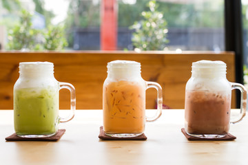 colorful milk tea beverage on wood table