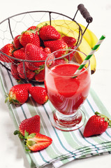 Strawberry drink with fresh berries and bananas