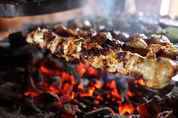 Skewers with meat on the grill
