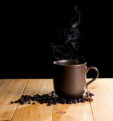 cup of black coffee over grunge wood