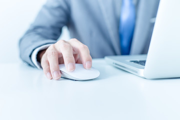 Closeup of businessman hands typing on laptop computer