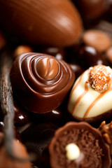 Chocolates background. Praline chocolate sweets