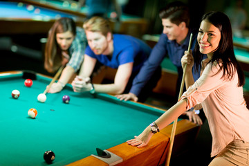 Young people playing pool