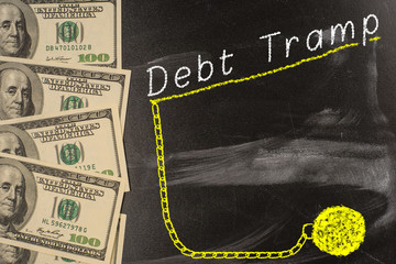 Text on blackboard with money - Debt Trap