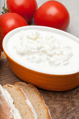 Cottage cheese, bread and tomatoes.