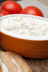 Cottage cheese, bread and tomatoes.
