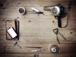 Vintage barber shop equipment on wood background with place for