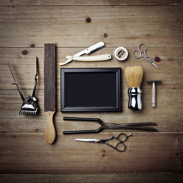 Set of vintage tools of barber shop with black picture frame