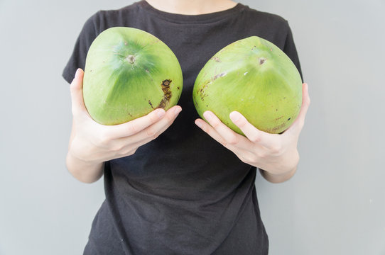 woman breast coconut fruit implant upsize metaphor concept