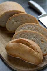 Sliced Ciabatta bread on wooden cutting board