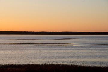 Obraz premium beautiful sunrise over country lake