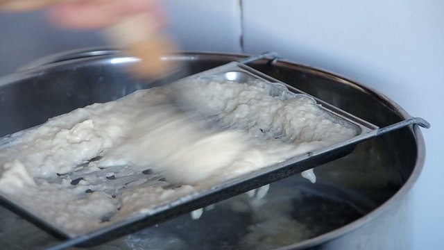 Cooking dumplings, falling gnocchi in boiling water