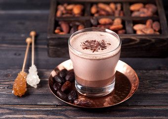 Delicious hot cocoa with chocolate and cocoa beans