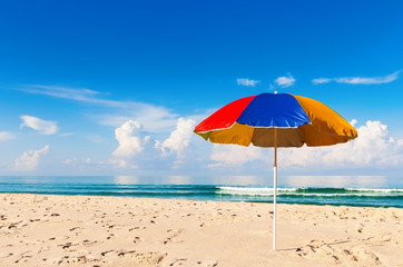 Fototapeta na wymiar umbrella and beautiful sand beach