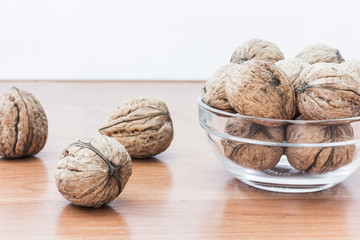 Walnuts on wooden background