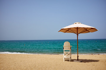 A lifeguard's chair on the beach.