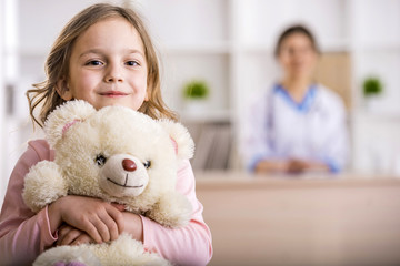 Little girl in a doctor - Powered by Adobe