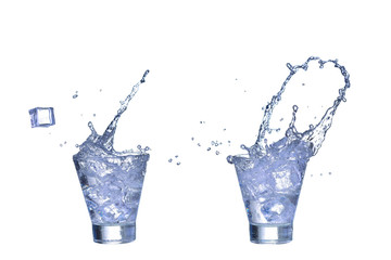 Glass of fresh water, ice cubes make splash isolated