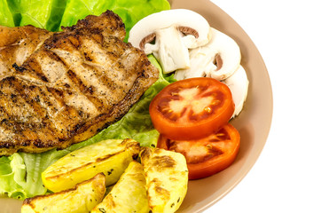 Grilled meat with vegetables and mushrooms isolated on white
