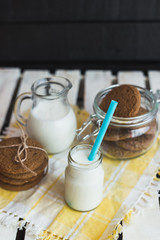 Rustic home made cookies on the wooden background with milk