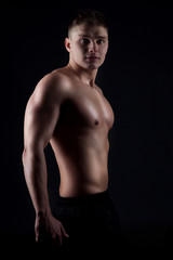 Fototapeta premium Handsome muscular man posing.