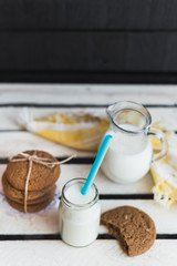 Rustic home made cookies on the wooden background with milk