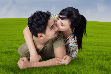 Woman kiss her husband at field