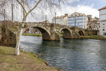 Fototapeta na wymiar Ancient pre-Roman bridge in Monforte de Lemos