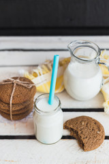 Rustic home made cookies on the wooden background with milk