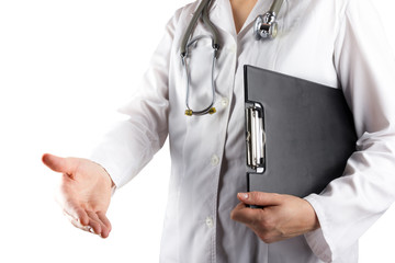 Female doctor's hand holding medical clipboard and stethoscope,