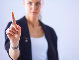 Woman touching an imaginary screen with her finger