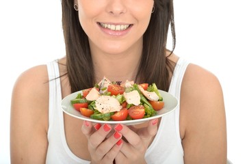 Young Healthy Happy woman Holding a Plate of Salmon Salad