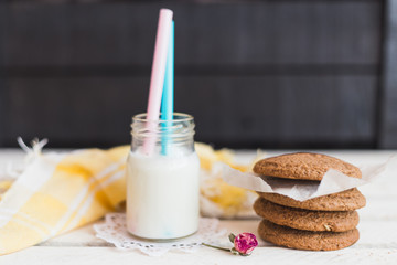 Rustic home made cookies on the wooden background with milk