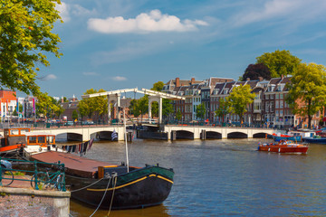 Fototapeta na wymiar Amstel and bridge Magere Brug, Amsterdam, Holland