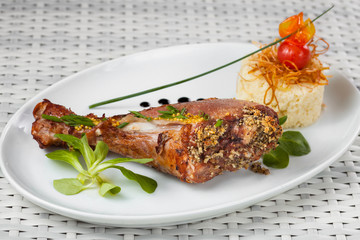 chicken legs with garnish on a light background