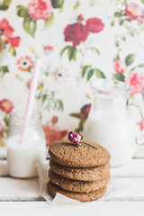 Rustic home made cookies on the wooden background with milk