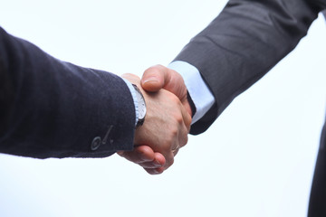 Closeup of a business handshake, on white background