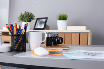 Designer's table with notes and tools