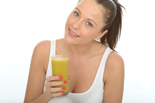 Young Woman Holding a Glass of Lime and Mango smoothie