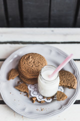 Rustic home made cookies on the wooden background with milk