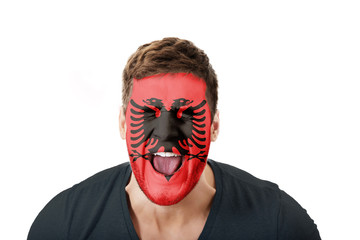 Screaming man with Albania flag on face.